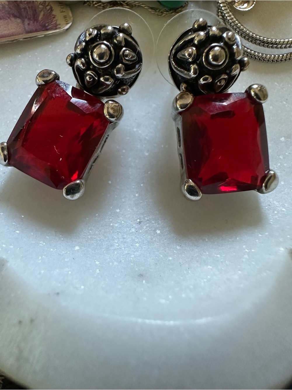 Silver tone and red crystal earrings
